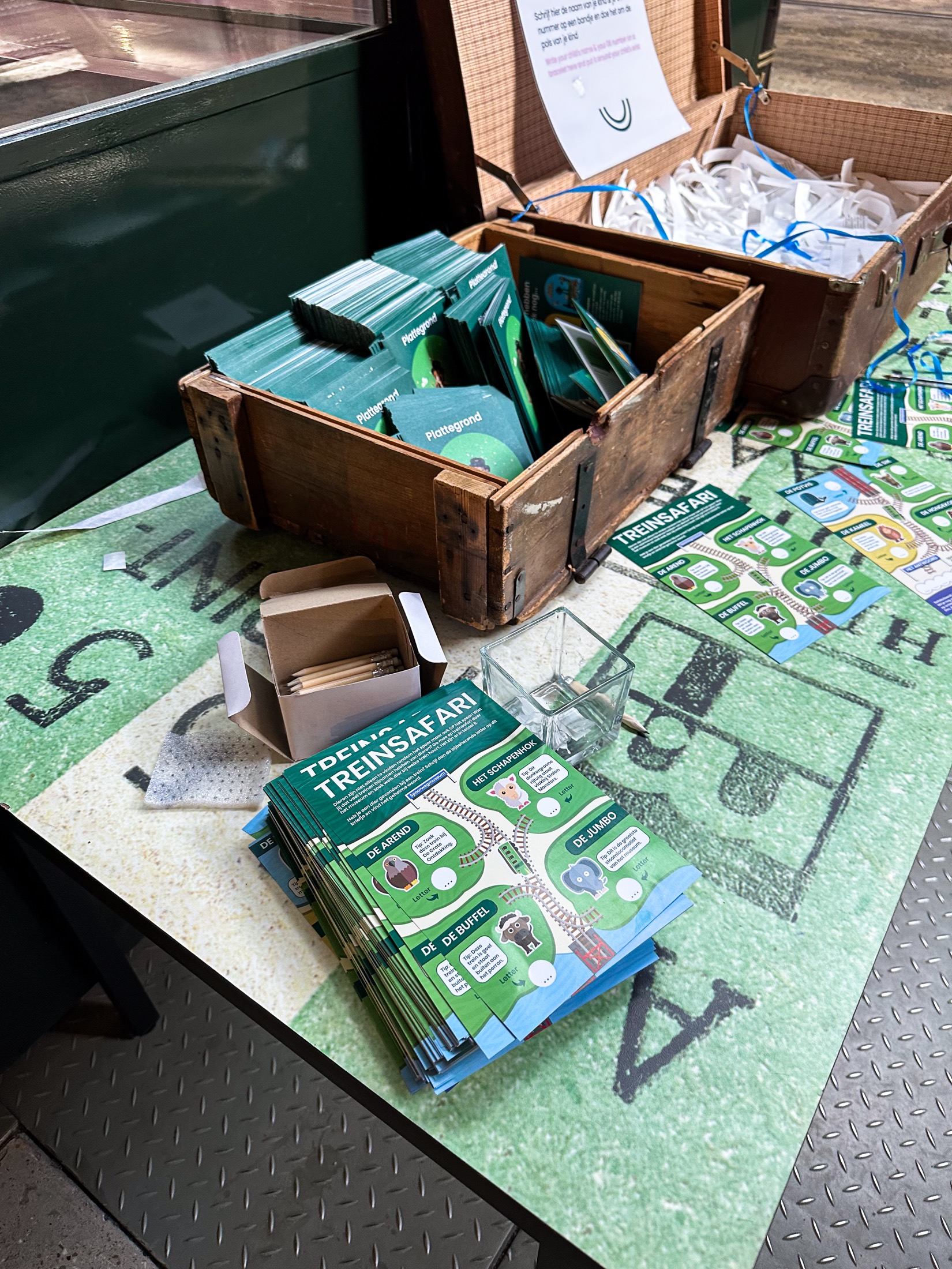 Stacks of handouts ready at the museum entrance